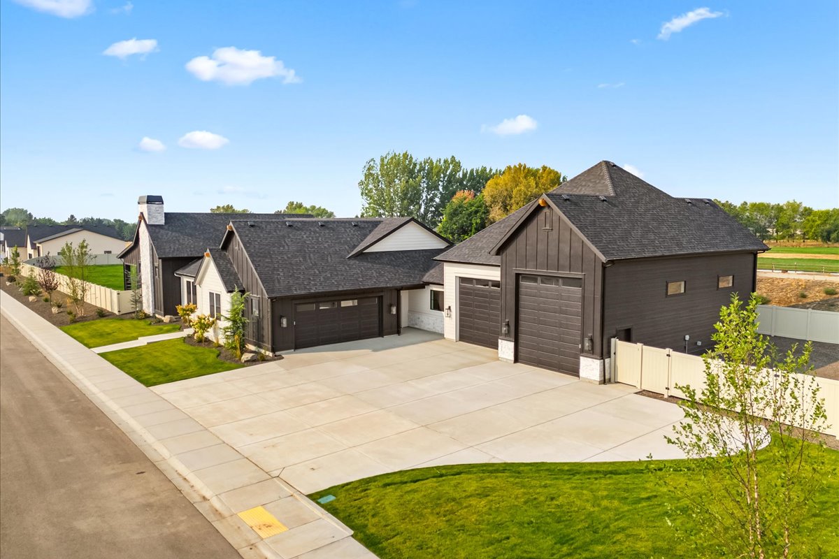 Aerial view of a custom home with RV garage